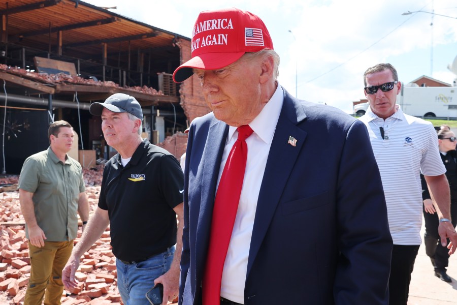 Former U.S. President Donald Trump prepares to leave after visiting Chez What Furniture store that was damaged during Hurricane Helene on September 30, 2024 in Valdosta, Georgia.