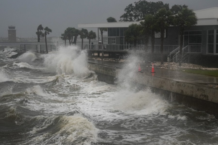 Waves crash along St. Pete Pier in St. Petersburg, Florida, as Hurricane Milton is expected to make landfall tonight on October 9, 2024.