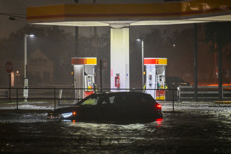 A vehicle is stranded on a water-flooded street after Hurricane Milton made landfall in Brandon, Florida on October 9, 2024.