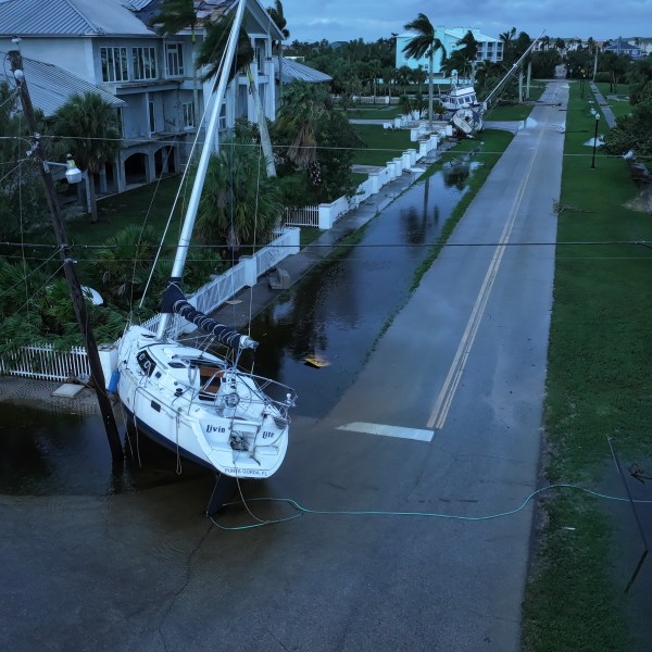 A boat rests in a street after it was washed ashore by Hurricane Milton.