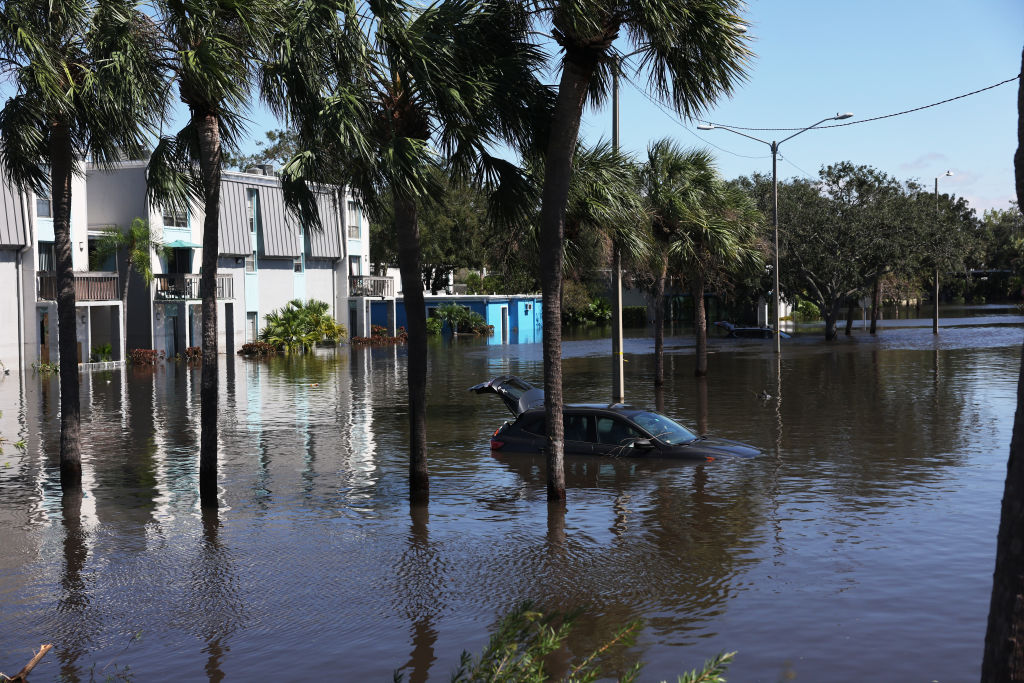 Cars are flooded in an apartment complex by Hurricane Milton.