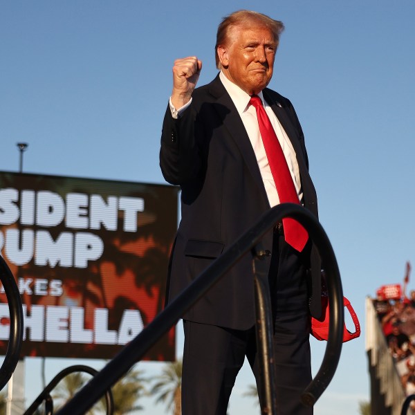 Republican presidential nominee, former U.S. President Donald Trump, gestures while walking onstage.