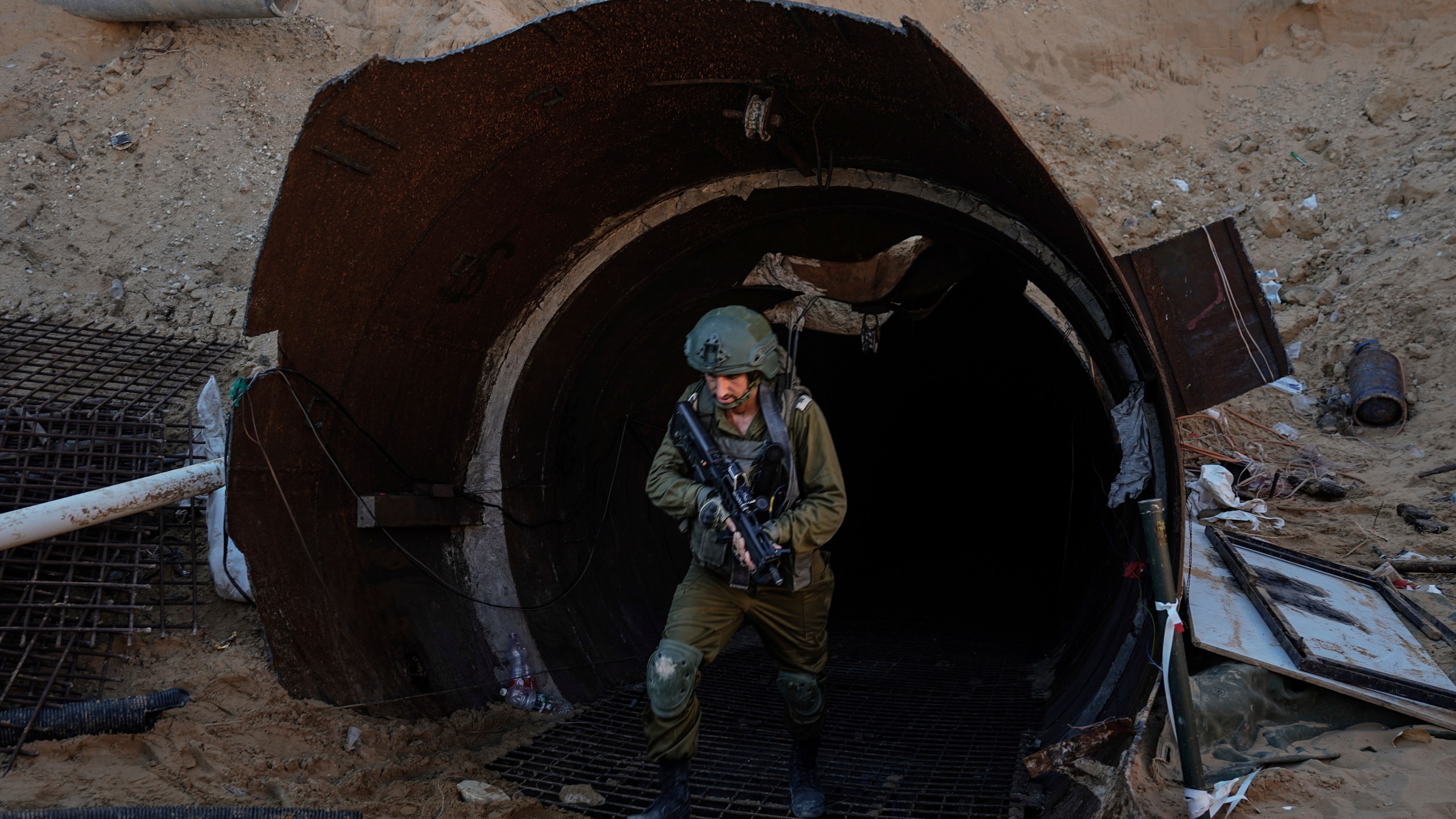 FILE - Israeli soldiers exit a tunnel that the military says Hamas militants used to attack the Erez crossing in the northern Gaza Strip, on Dec. 15, 2023. (AP Photo/Ariel Schalit, File)