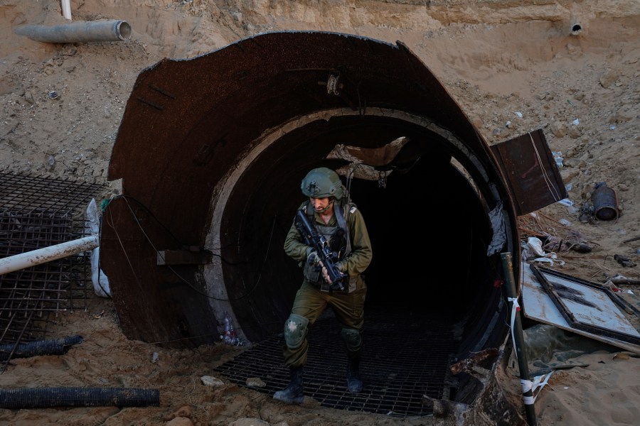 FILE - Israeli soldiers exit a tunnel that the military says Hamas militants used to attack the Erez crossing in the northern Gaza Strip, on Dec. 15, 2023. (AP Photo/Ariel Schalit, File)