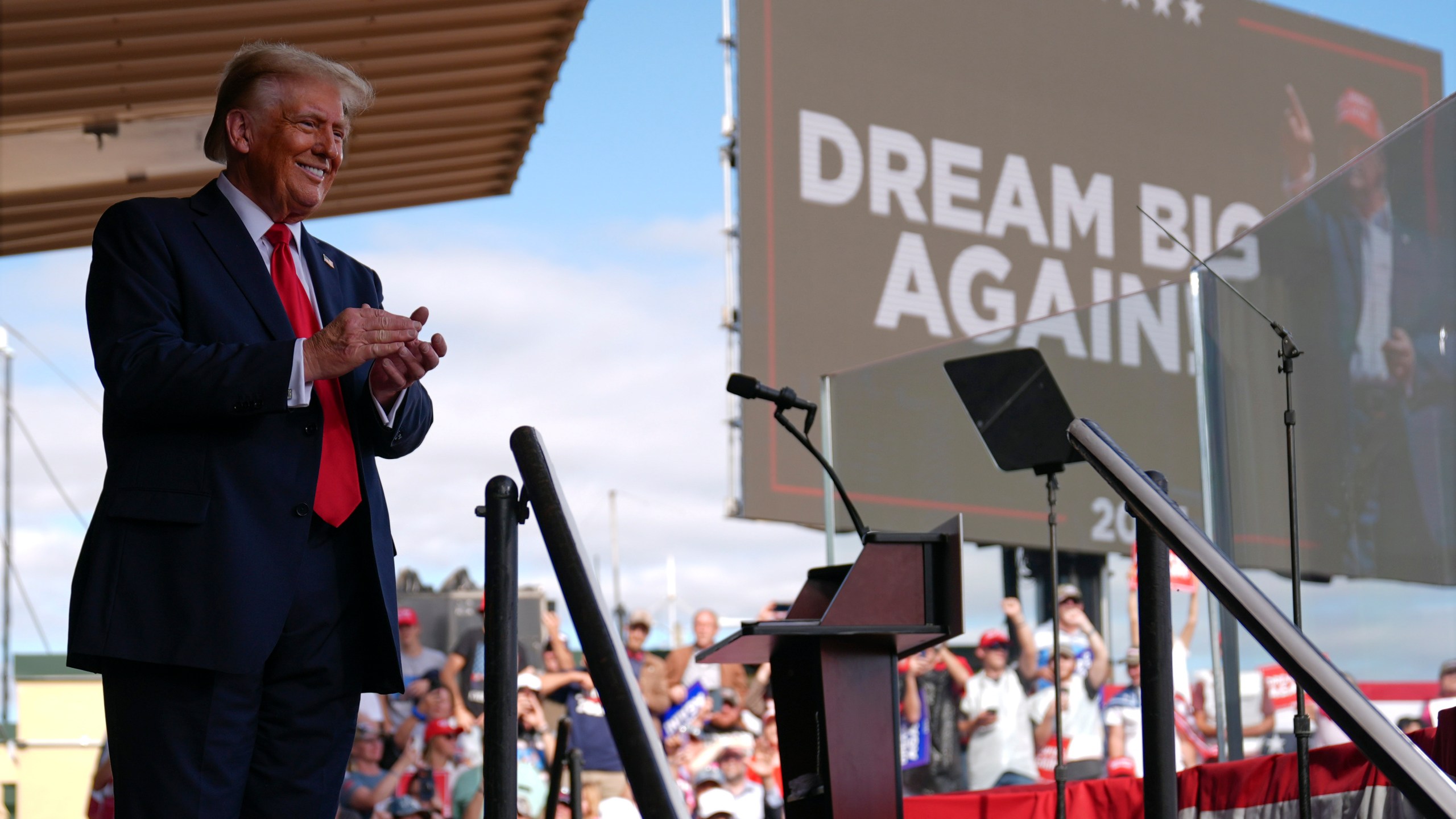 Republican presidential nominee former President Donald Trump smiles at a campaign rally at Gastonia Municipal Airport, Saturday, Nov. 2, 2024, in Gastonia, N.C. (AP Photo/Evan Vucci)