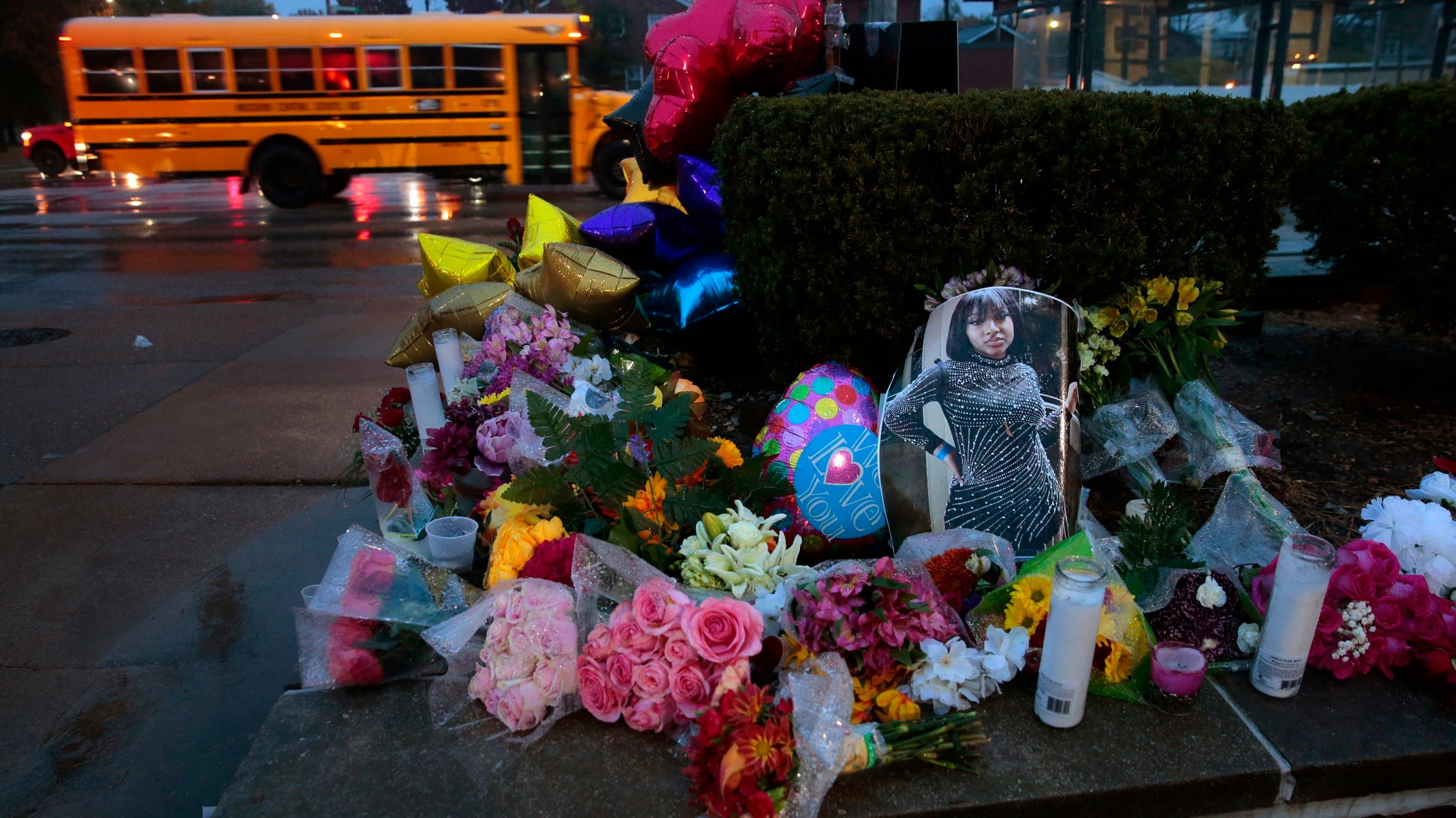 FILE - A photo of Alexandria Bell rests at the scene of a growing floral memorial to the victims of a school shooting at Central Visual & Performing Arts High School, Oct. 25, 2022, in St. Louis. (Robert Cohen/St. Louis Post-Dispatch via AP, File)