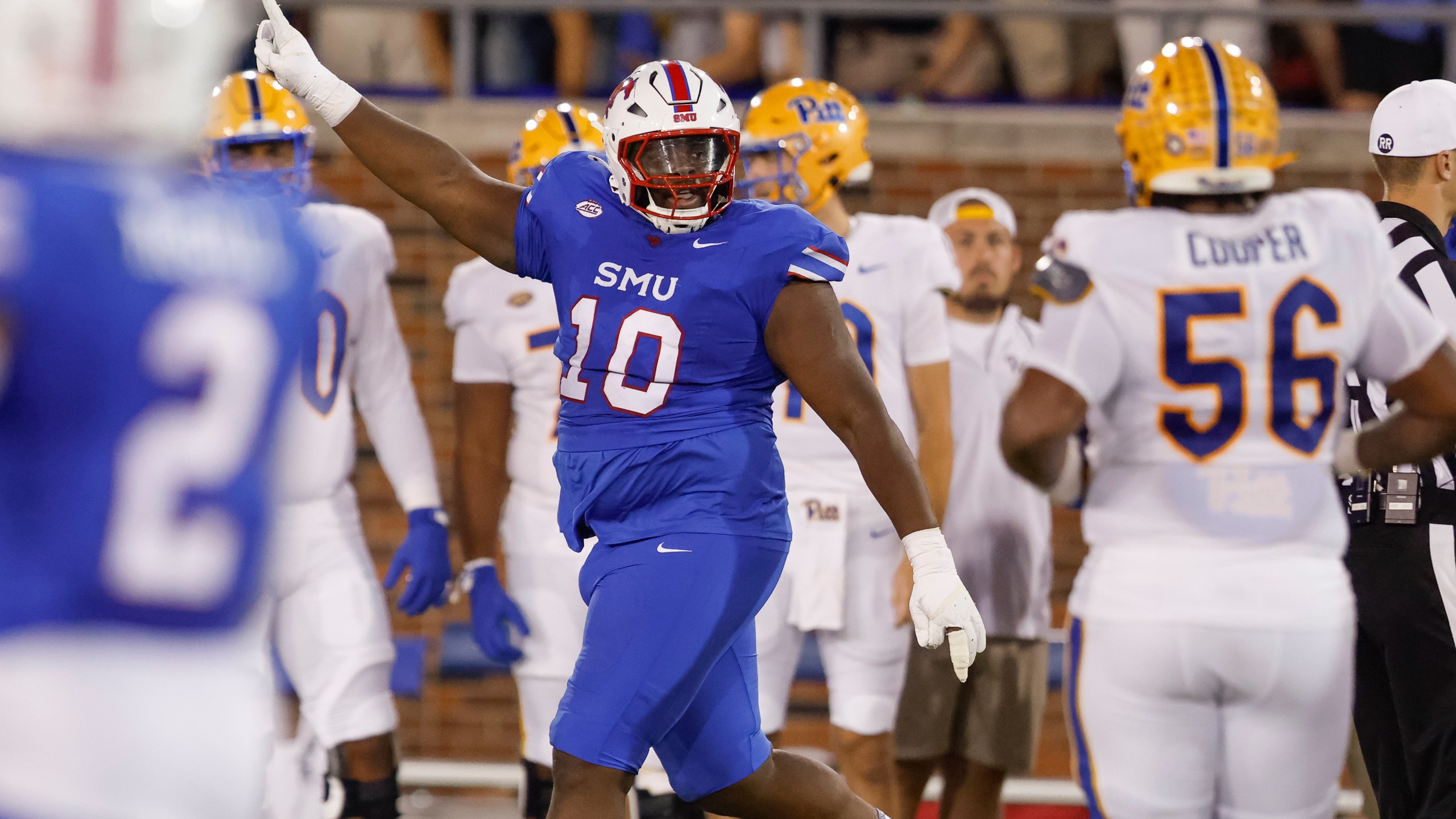 SMU defensive tackle Anthony Booker Jr. (10) celebrates during the first half of an NCAA college football game against SMU in Dallas, Saturday, Nov. 2, 2024. (AP Photo/Gareth Patterson)