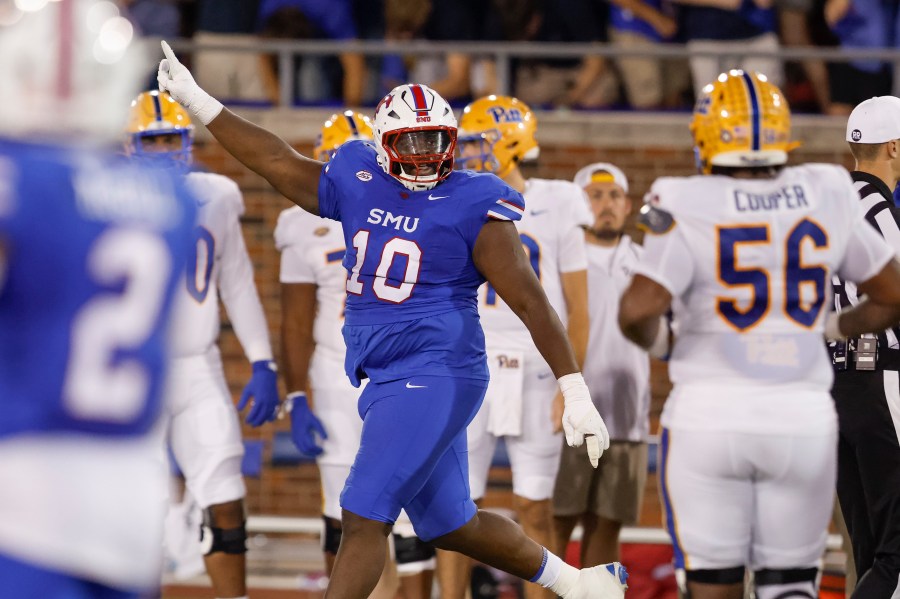 SMU defensive tackle Anthony Booker Jr. (10) celebrates during the first half of an NCAA college football game against SMU in Dallas, Saturday, Nov. 2, 2024. (AP Photo/Gareth Patterson)