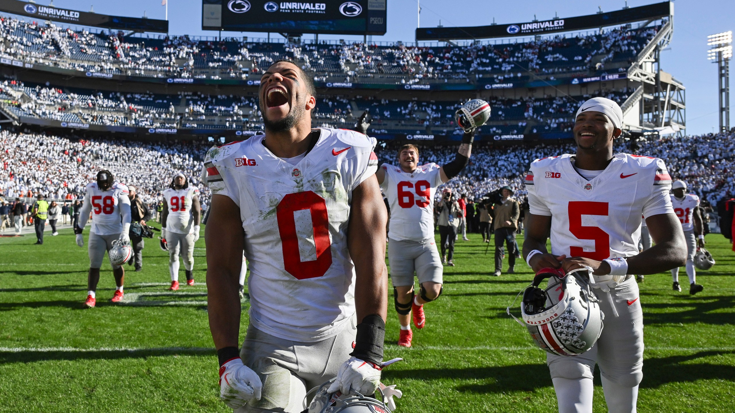 Ohio State linebacker Cody Simon (0) celebrates after defeating Penn State 20-13 in an NCAA college football game, Saturday, Nov. 2, 2024, in State College, Pa. (AP Photo/Barry Reeger)