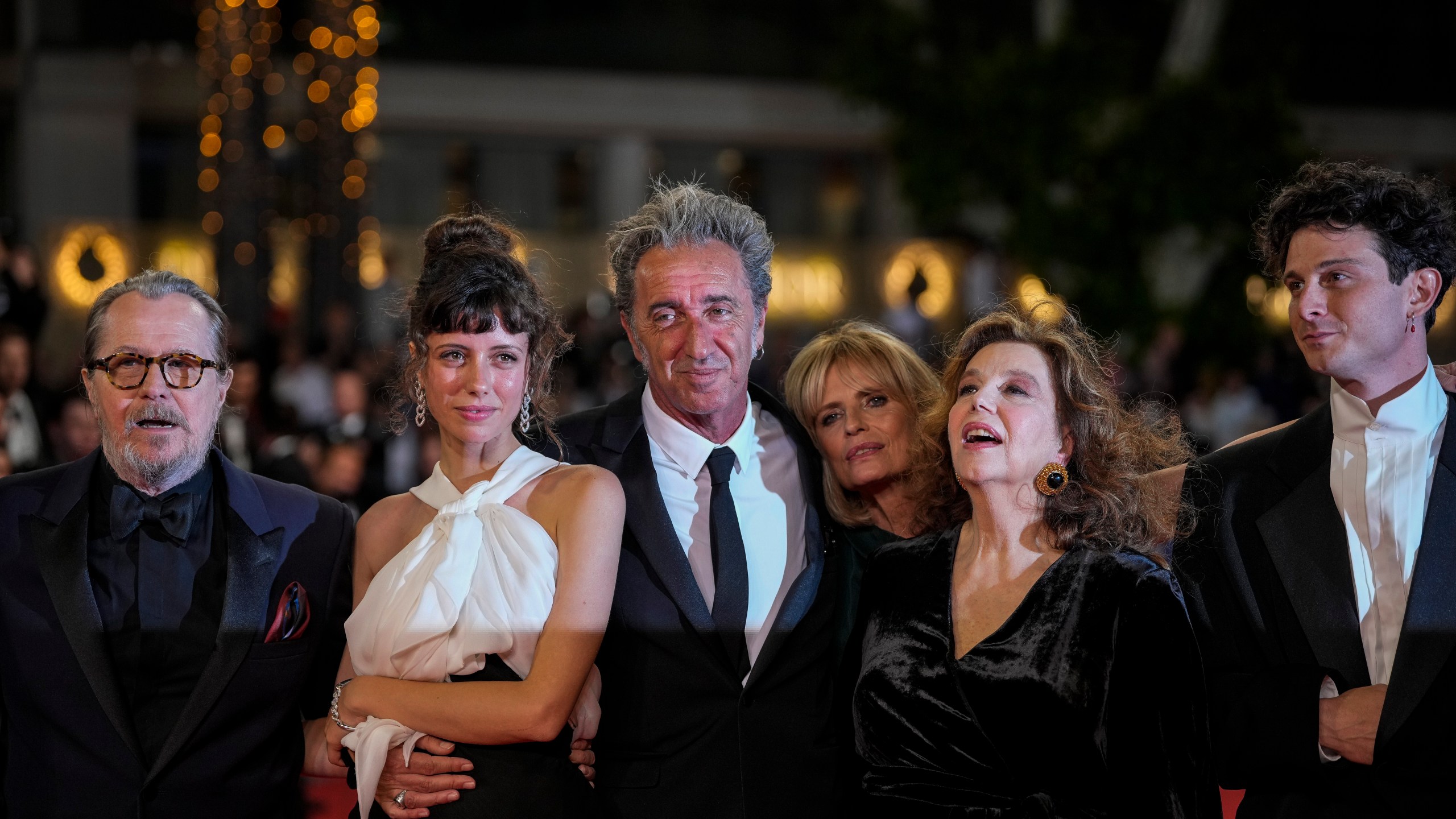 FILE -- From left, Gary Oldman, Celeste Dalla Porta, director Paolo Sorrentino, Isabella Ferrari, Stefania Sandrelli, and Daniele Rienzo pose for photographers upon arrival at the premiere of the film 'Parthenope' at the 77th Cannes International Film Festival, in Cannes, southern France, Tuesday, May 21, 2024. (Photo by Andreea Alexandru/Invision/AP)