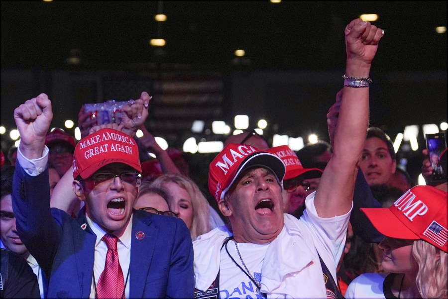 Supporters arrive at an election night watch party for Republican presidential nominee former President Donald Trump Tuesday, Nov. 5, 2024, in West Palm Beach, Fla. (AP Photo/Evan Vucci)