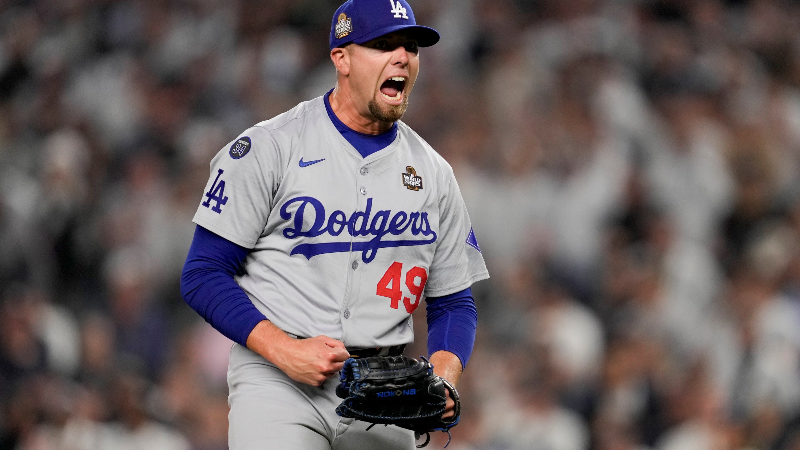 Los Angeles Dodgers pitcher Blake Treinen celebrates the end of the eighth inning in Game 5 of the baseball World Series against the New York Yankees, Wednesday, Oct. 30, 2024, in New York. (AP Photo/Ashley Landis)