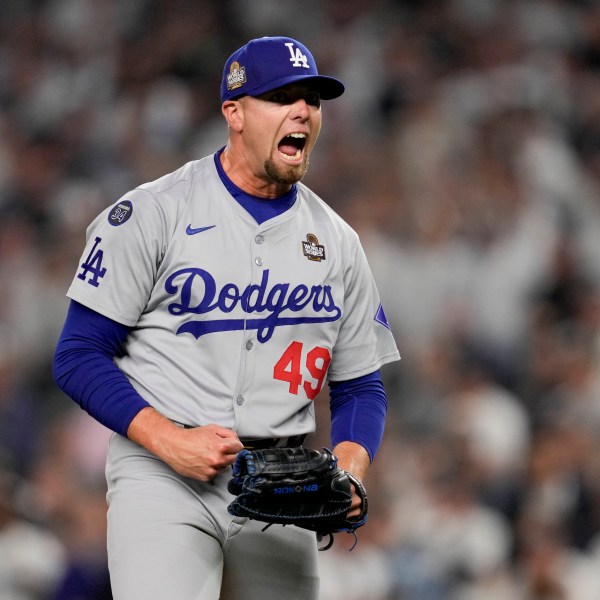 Los Angeles Dodgers pitcher Blake Treinen celebrates the end of the eighth inning in Game 5 of the baseball World Series against the New York Yankees, Wednesday, Oct. 30, 2024, in New York. (AP Photo/Ashley Landis)