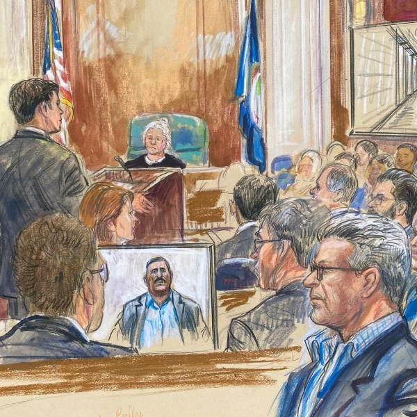 FILE - This courtroom sketch depicts a former detainee at Abu Ghraib prison, Salah Al-Ejaili, foreground with glasses, at the trial of CACI, a Virginia-based military contractor who is accused of contributing to the abuse and torture of detainees at Abu Ghraib, in U.S. District Court in Alexandria, Va., April 16, 2024. (Dana Verkouteren via AP, File)