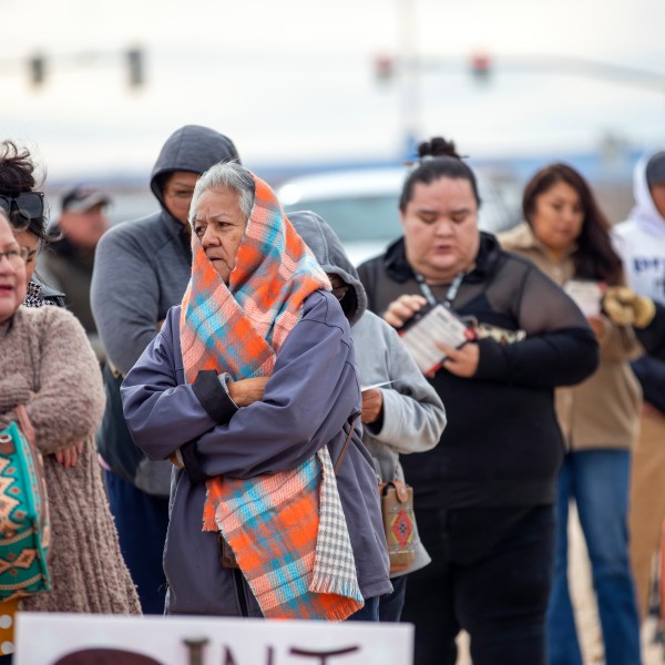 Voters wait in line to cast their ballots outside a polling station on the Navajo Nation in Chinle, Ariz., on Election Day, Tuesday, Nov. 5, 2024. (AP Photo/Andres Leighton)