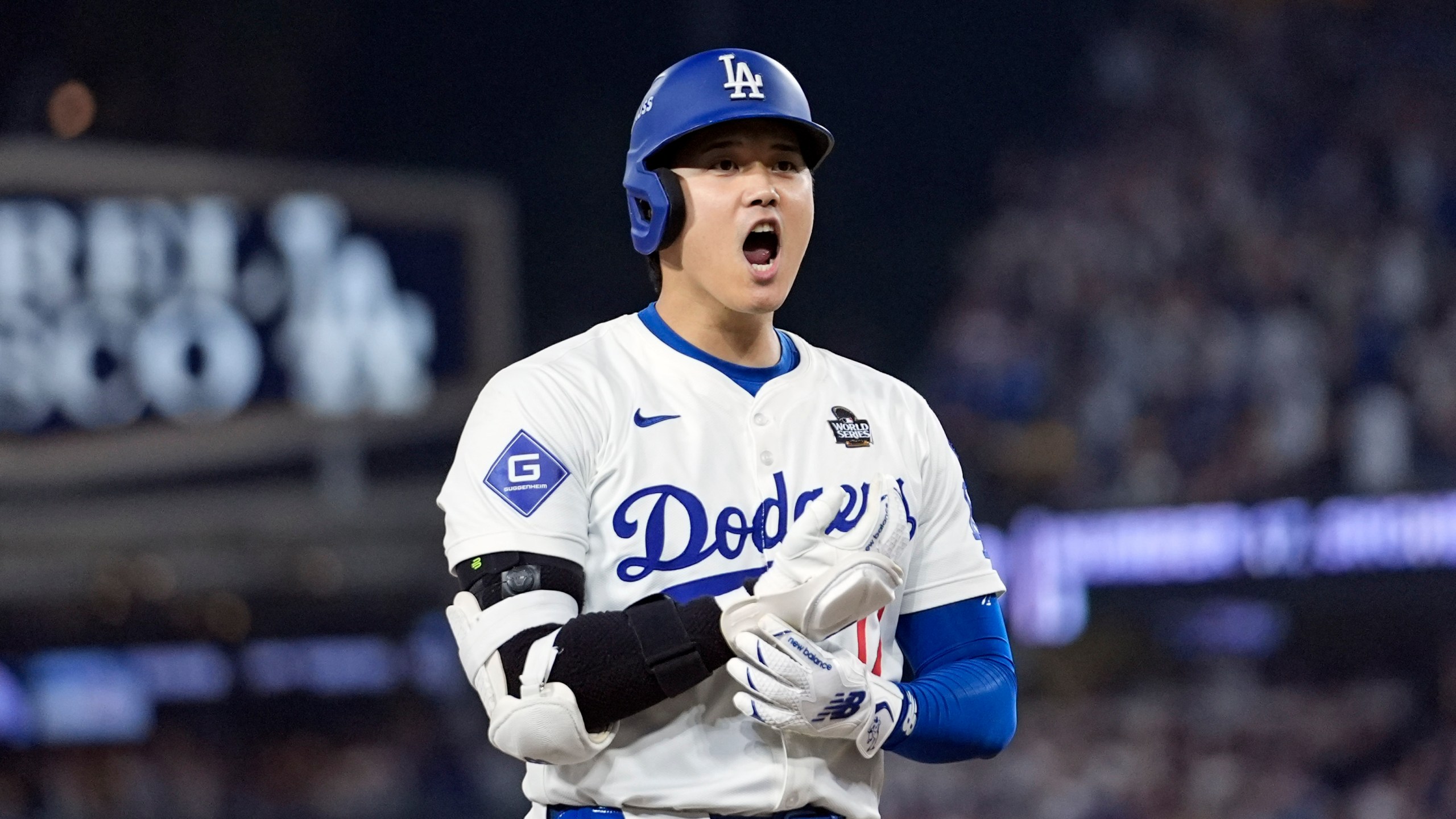 Los Angeles Dodgers' Shohei Ohtani reacts after advancing to third on a fielding error by New York Yankees second baseman Gleyber Torres during the eighth inning in Game 1 of the baseball World Series, Friday, Oct. 25, 2024, in Los Angeles. (AP Photo/Godofredo A. Vásquez)