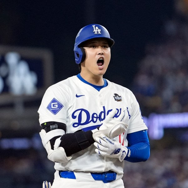 Los Angeles Dodgers' Shohei Ohtani reacts after advancing to third on a fielding error by New York Yankees second baseman Gleyber Torres during the eighth inning in Game 1 of the baseball World Series, Friday, Oct. 25, 2024, in Los Angeles. (AP Photo/Godofredo A. Vásquez)