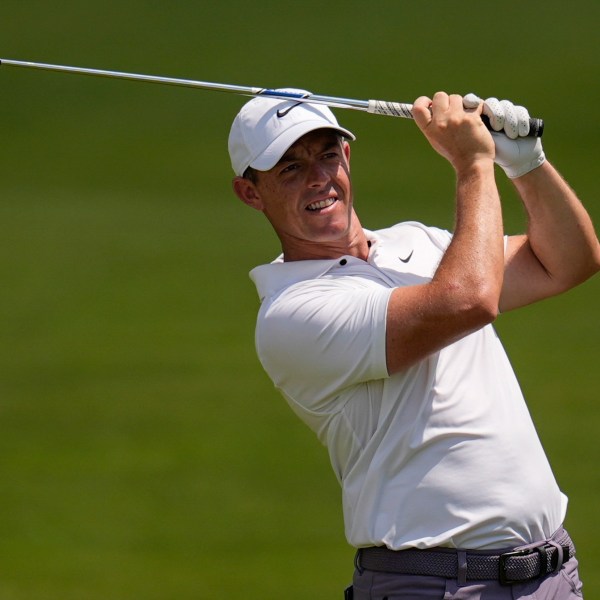 FILE - Rory McIlroy, of Northern Ireland, hits out of the seventh fairway during the second round of the Tour Championship golf tournament, Friday, Aug. 30, 2024, in Atlanta. (AP Photo/Mike Stewart, File)