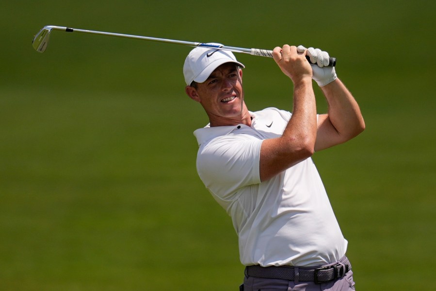 FILE - Rory McIlroy, of Northern Ireland, hits out of the seventh fairway during the second round of the Tour Championship golf tournament, Friday, Aug. 30, 2024, in Atlanta. (AP Photo/Mike Stewart, File)