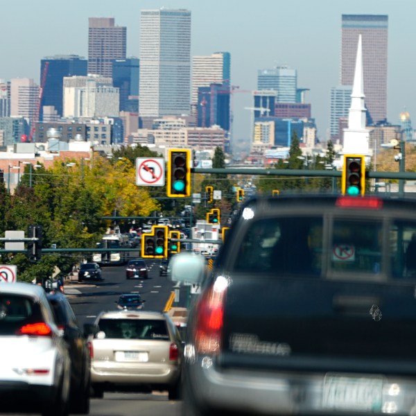 FILE - Heavy traffic moves northbound along South Broadway at Hampden Avenue as the Denver city skyline hangs in the background, Oct. 23, 2024, in Englewood, Colo. (AP Photo/David Zalubowski)