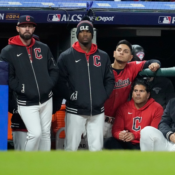 Cleveland Guardians players watch from the dugout during the 10th inning against the New York Yankees in Game 5 of the baseball AL Championship Series Saturday, Oct. 19, 2024, in Cleveland. The Yankees won 5-2. (AP Photo/Godofredo A. Vásquez)