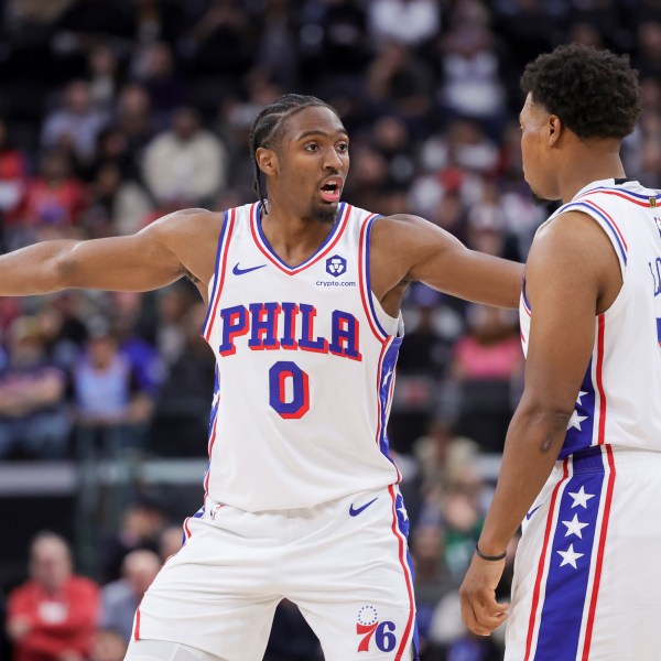 Philadelphia 76ers guard Tyrese Maxey, left, reacts next to guard Kyle Lowry during the second half of an NBA basketball game, Wednesday, Nov. 6, 2024, in Inglewood, Calif. (AP Photo/Ryan Sun)