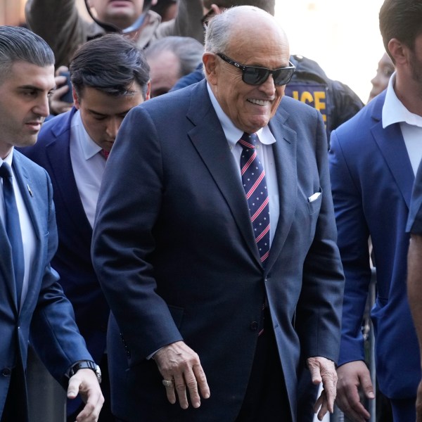 Rudy Giuliani, center, arrives to federal court in New York, Thursday, Nov. 7, 2024. (AP Photo/Seth Wenig)