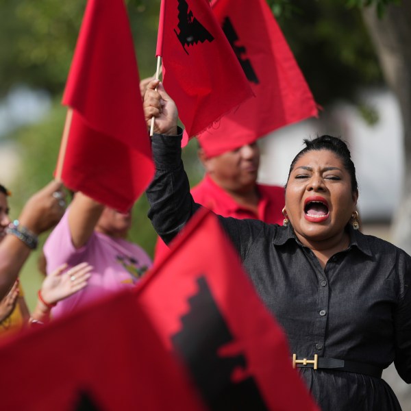 Tania Chavez, right, executive director of La Unión del Pueblo Entero (LUPE), leads members in a chant after making statements about yesterday's election, in San Juan, Texas, Wednesday, Nov. 6, 2024. (AP Photo/Eric Gay)