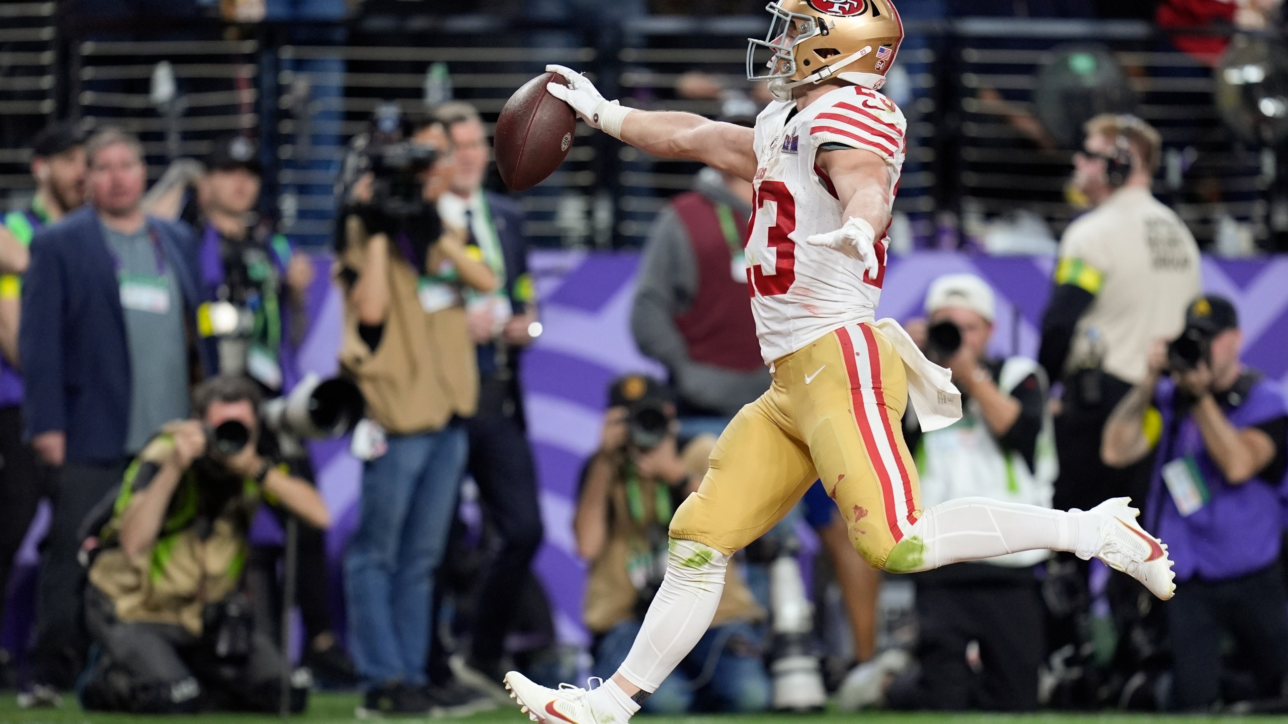 FILE - San Francisco 49ers running back Christian McCaffrey (23) scores a touchdown against the Kansas City Chiefs during the first half of the NFL Super Bowl 58 football game Sunday, Feb. 11, 2024, in Las Vegas. (AP Photo/Eric Gay, File)