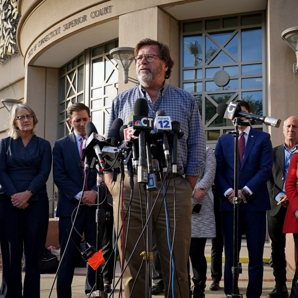 FILE - Bill Sherlach, husband of Mary, one of the Sandy Hook School shooting victims, speaks to the media after jurors returned a $965 million dollar judgement in the defamation trial against Alex Jones, in Waterbury, Conn., Oct. 12, 2022. (AP Photo/Bryan Woolston, File)