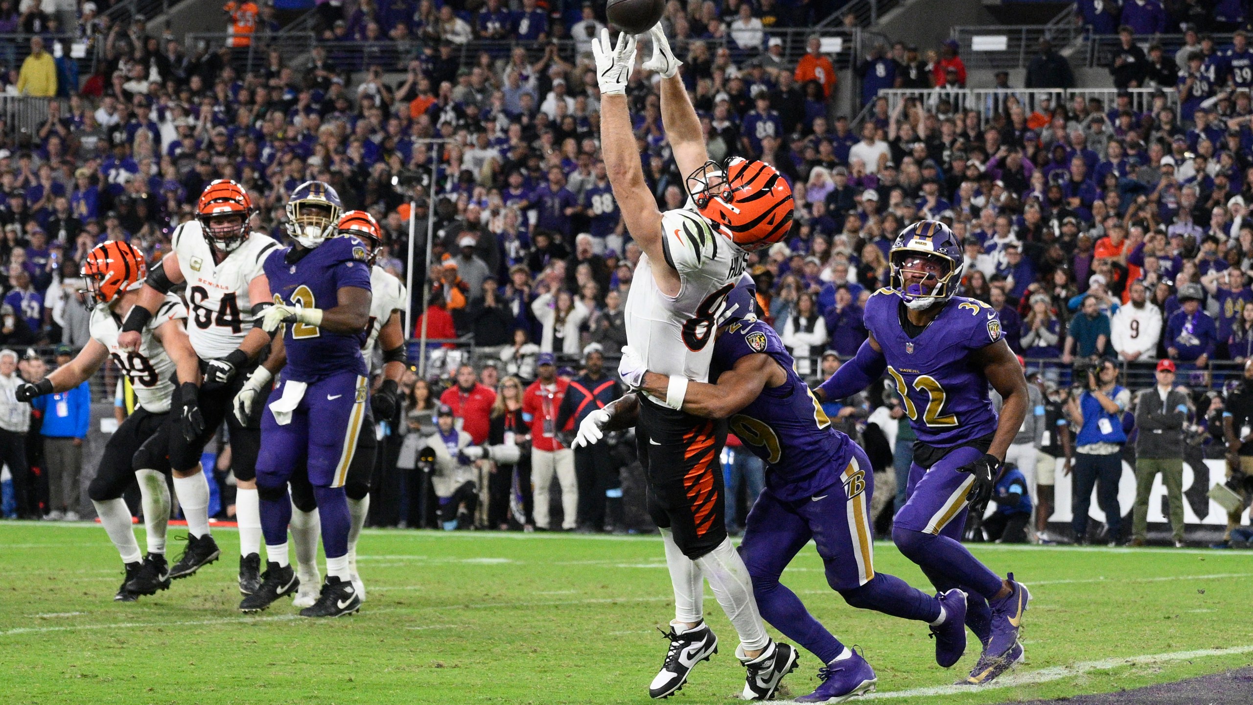 Cincinnati Bengals tight end Tanner Hudson (87) misses a two-point conversion as Baltimore Ravens safety Ar'Darius Washington (29) defends and Baltimore Ravens safety Marcus Williams (32) looks on during the second half of an NFL football game, Thursday, Nov. 7, 2024, in Baltimore. (AP Photo/Nick Wass)