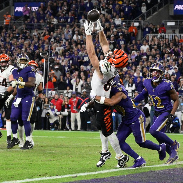 Cincinnati Bengals tight end Tanner Hudson (87) misses a two-point conversion as Baltimore Ravens safety Ar'Darius Washington (29) defends and Baltimore Ravens safety Marcus Williams (32) looks on during the second half of an NFL football game, Thursday, Nov. 7, 2024, in Baltimore. (AP Photo/Nick Wass)