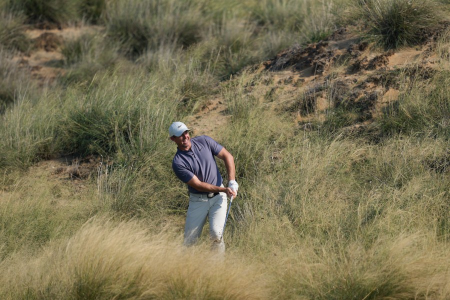 Rory McIlroy of Northern Ireland plays his second shot at the 13th hole during the second round of Abu Dhabi Golf Championship in Abu Dhabi, United Arab Emirates, Friday, Nov. 8, 2024. (AP Photo/Altaf Qadri)