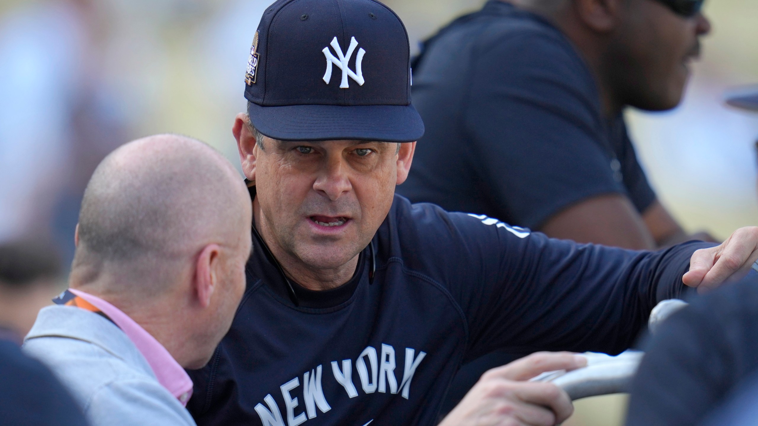 New York Yankees manager Aaron Boone, right, talks with general manager Brian Cashman during batting practice before Game 1 of the baseball World Series, Friday, Oct. 25, 2024, in Los Angeles. (AP Photo/Julio Cortez)