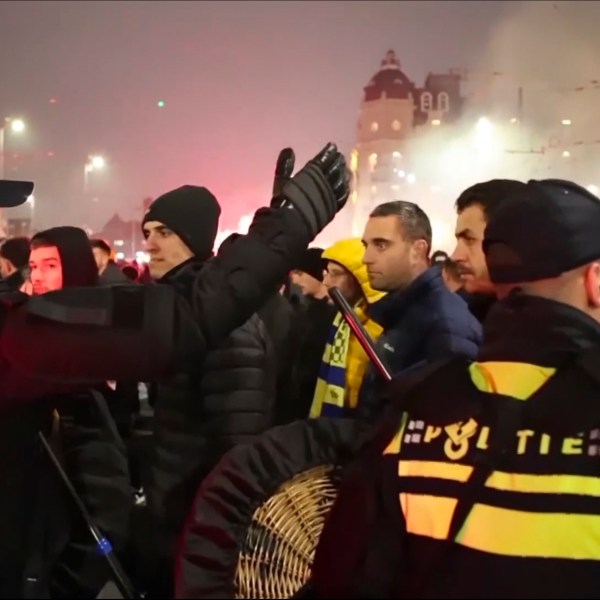 In this image taken from video, police escort Maccabi Tel Aviv supporters to the metro station leading them to the Ajax stadium, after pro-Palestinian supporters marched near the stadium, in Amsterdam, the Netherlands, Thursday, Nov. 7, 2024. (AP Photo InterVision)