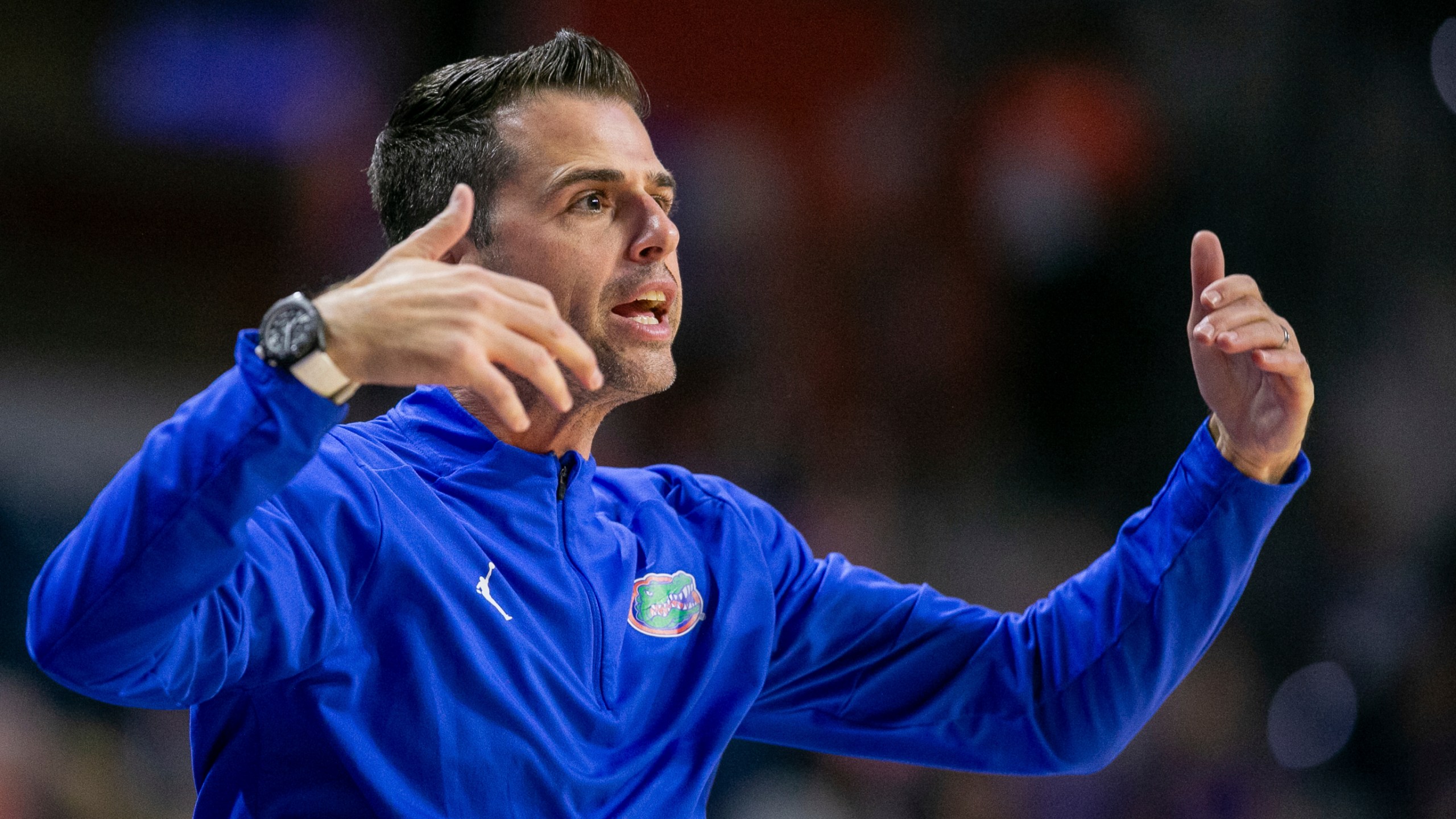 Florida head coach Todd Golden coaches form the siideline during the first half of an NCAA college basketball game against Jacksonville Thursday, Nov. 7, 2024, in Gainesville, Fla. (AP Photo/Alan Youngblood)