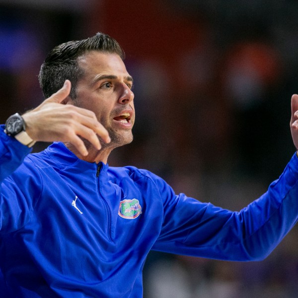 Florida head coach Todd Golden coaches form the siideline during the first half of an NCAA college basketball game against Jacksonville Thursday, Nov. 7, 2024, in Gainesville, Fla. (AP Photo/Alan Youngblood)