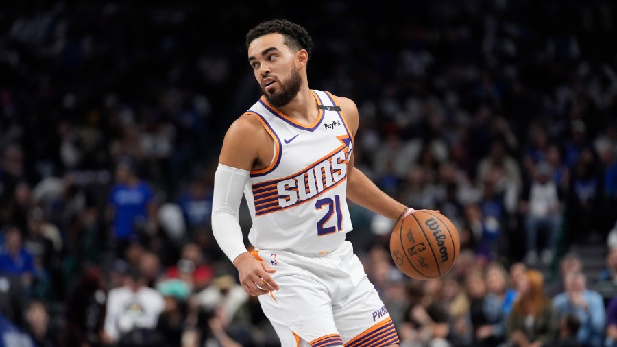 Phoenix Suns guard Tyus Jones (21) moves the ball during the first half of an NBA basketball game against the Dallas Mavericks Friday, Nov. 8, 2024, in Dallas. (AP Photo/LM Otero)