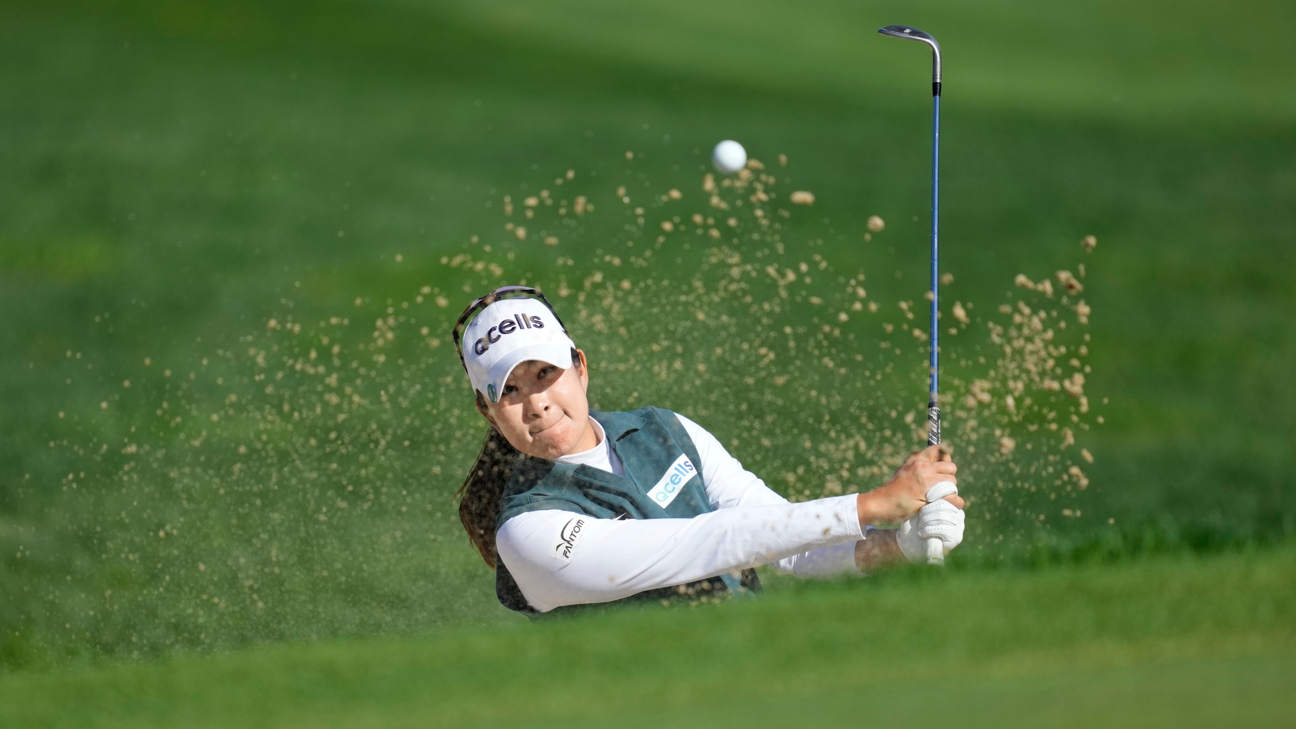 A Lim Kim of South Korea hits out of a bunker on the 3rd hole during the final round of the LPGA Ladies Championship golf tournament at the Seowon Valley Country Club in Paju, South Korea, Sunday, Oct. 20, 2024. (AP Photo/Lee Jin-man)