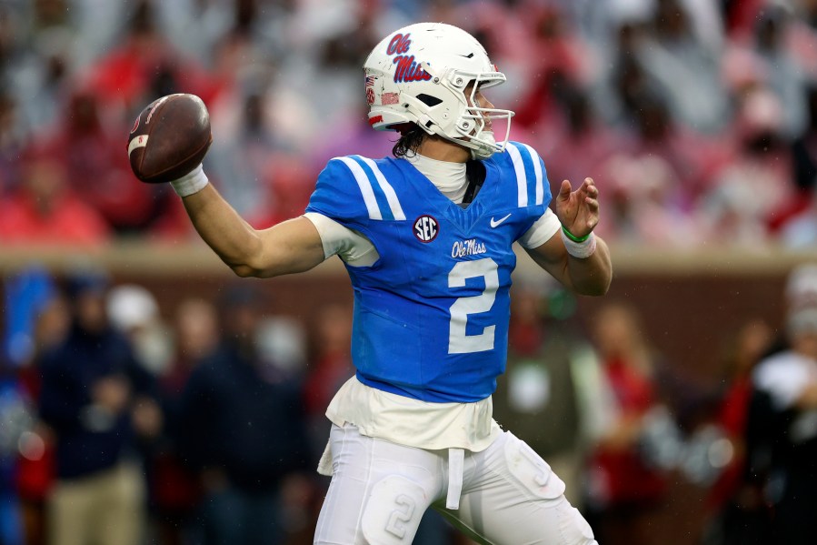 Mississippi quarterback Jaxson Dart (2) throws a pass during the first half of an NCAA college football game against Georgia, Saturday, Nov. 9, 2024, in Oxford, Miss. (AP Photo/Randy J. Williams)