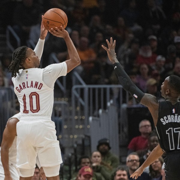 Cleveland Cavaliers' Darius Garland (10) shoots over Brooklyn Nets' Dennis Schroder (17) during the first half of an NBA basketball game in Cleveland, Saturday, Nov. 9, 2024. (AP Photo/Phil Long)