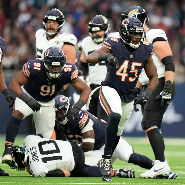 Chicago Bears linebacker Amen Ogbongbemiga (45) reacts after Jacksonville Jaguars quarterback Mac Jones (10) was sacked during an NFL football game at the Tottenham Hotspur stadium between the Jacksonville Jaguars and Chicago Bears in London, Sunday, Oct. 13, 2024. (AP Photo/Alastair Grant)