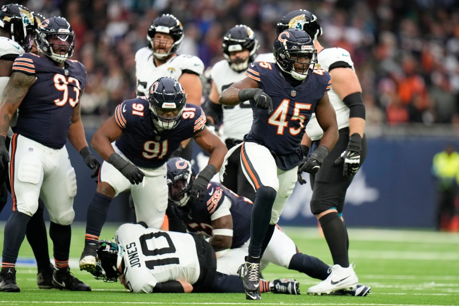 Chicago Bears linebacker Amen Ogbongbemiga (45) reacts after Jacksonville Jaguars quarterback Mac Jones (10) was sacked during an NFL football game at the Tottenham Hotspur stadium between the Jacksonville Jaguars and Chicago Bears in London, Sunday, Oct. 13, 2024. (AP Photo/Alastair Grant)