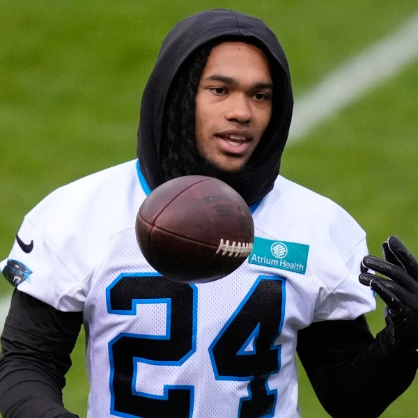 Carolina Panthers running back Jonathon Brooks (24) lifts a ball during a practice session in Munich, Germany, Friday, Nov. 8, 2024. The Carolina Panthers are set to play the New York Giants in an NFL game at the Allianz Arena in Munich on Sunday Nov. 10. (AP Photo/Matthias Schrader)