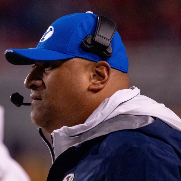 BYU head coach Kalani Sitake watches from the sideline in the first half of an NCAA college football game against Utah, Saturday, Nov. 9, 2024, in Salt Lake City. (AP Photo/Spenser Heaps)