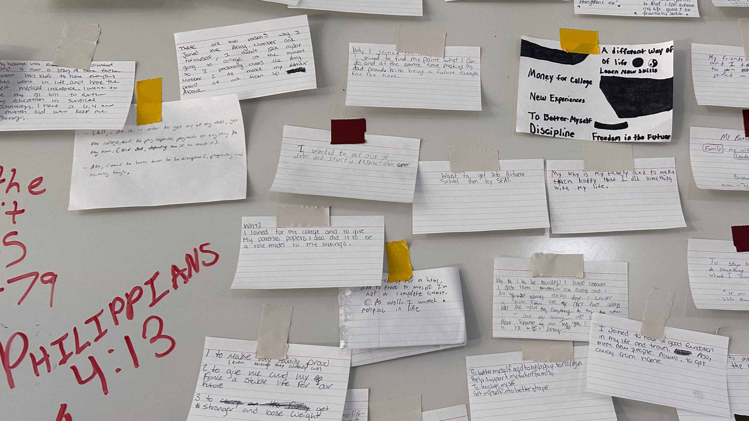 Index cards describing why the recruits joined the Army are taped to a large board on a wall at Fort Jackson, a U.S. Army Training Center, in Columbia, S.C., Sept. 25, 2024. (AP Photo/Lolita Baldor)