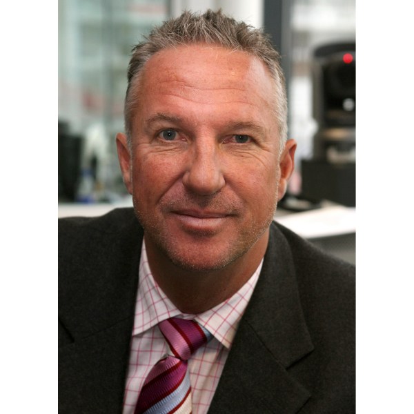 FILE - Former England cricketer Ian Botham prepares to commentate on the first day of England's fourth Test match of their four Test series against the West Indies in Durham, England on June 15, 2007 (AP Photo/Jon Super, File)