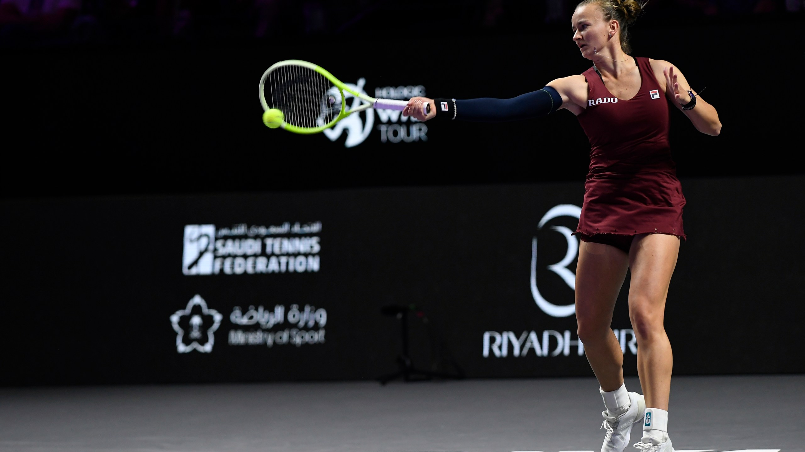 Czech Republic's Barbora Krejcikova shoots against China's Qinwen Zheng during their women's singles semi final match at King Saud University Indoor Arena, in Riyadh, Saudi Arabia, Friday, Nov. 8, 2024. (AP Photo)