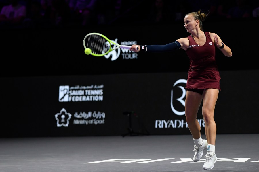 Czech Republic's Barbora Krejcikova shoots against China's Qinwen Zheng during their women's singles semi final match at King Saud University Indoor Arena, in Riyadh, Saudi Arabia, Friday, Nov. 8, 2024. (AP Photo)