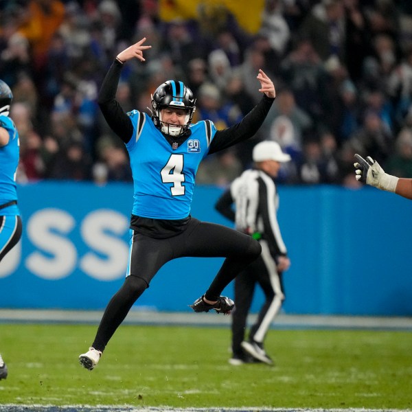 Carolina Panthers kicker Eddy Pineiro celebrates after kicking the game-winning field goal in overtime against New York Giants during an NFL football game, Sunday, Nov. 10, 2024, in Munich, Germany. (AP Photo/Matthias Schrader)